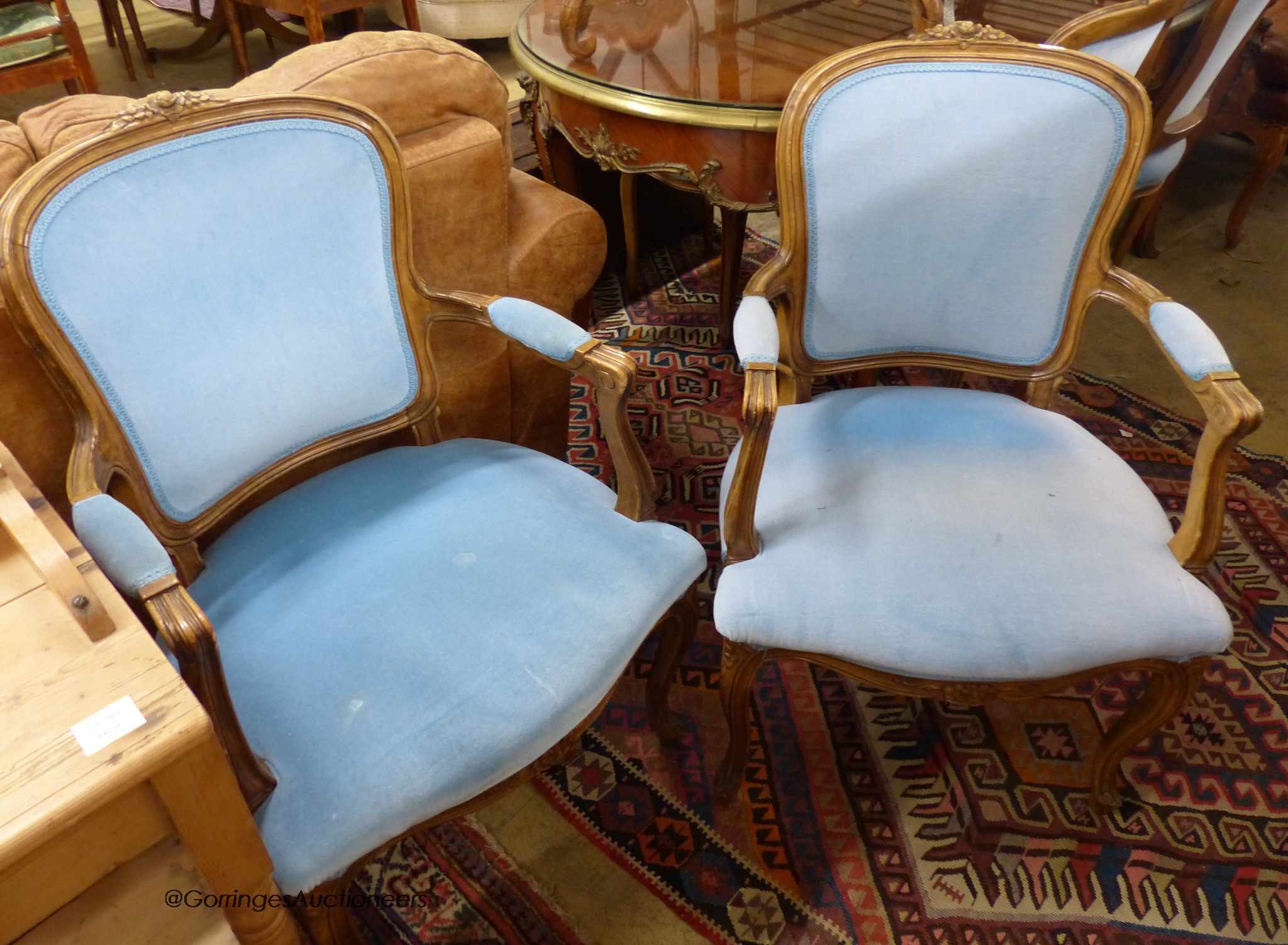 A set of six French beech upholstered dining chairs, two with arms